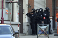 Special forces pictured on the scene of a police raid in Brussels. (BELGA PHOTO LAURIE DIEFFEMBACQ)