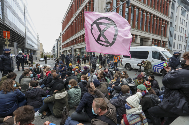 Protestors block the Wetstraat - Rue de la Loi street, the 'time4rage' protest action of climate activists Extinction Rebellion, in Brussels, Saturday 06 November 2021 in Brussels. The organization is pleading the COP26 Climate Conference for more urgency in fighting climate change. (BELGA PHOTO NICOLAS MAETERLINCK)