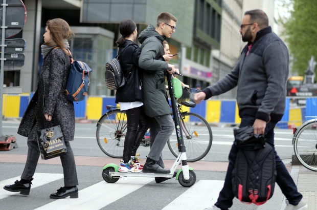 Illustration picture shows people riding a shared scooter in Brussels, Friday 03 May 2019. (BELGA PHOTO ERIC LALMAND)