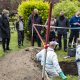 Justice Minister Vincent Van Quickenborne (L) and Alain Remue of the police unit for missing people 'Cel Vermiste Personen / Disparitions inquietantes' (center L) during an exhumation of an unidentified person, Tuesday 25 May 2021. (HAND OUT CABINET OF THE MINISTER OF JUSTICE)