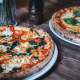 Neapolitan-style pizzas displayed on a restaurant table (Wikipedia Creative Commons)